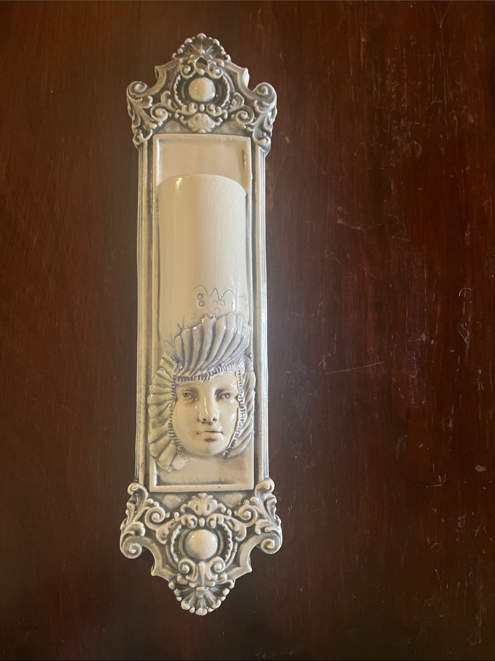Decorative Wall Sconce with Sculpted Face Accent - Cream & Silver